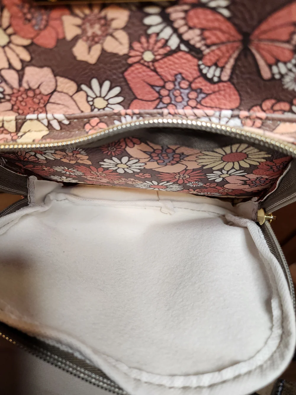 Jessica Simpson backpack with butterfly design.